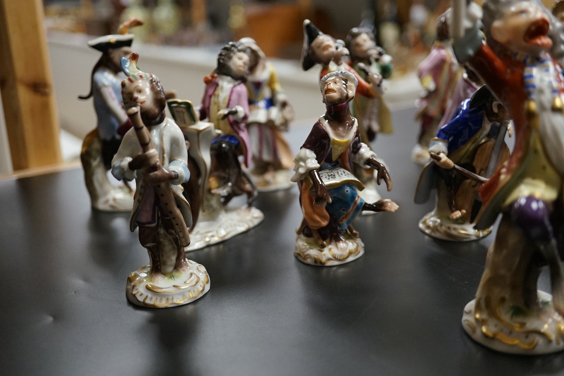 A group of twenty German porcelain monkey band figures, largest 15.5cm high